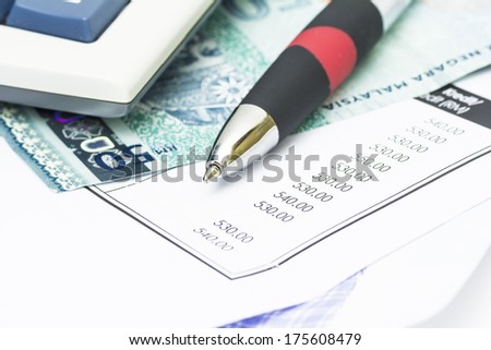 Ball pen, bank note and bank statement - financial concept
