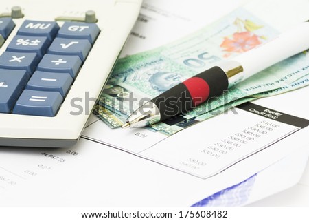 Pen on bank statement, a wealthy investment - financial concept