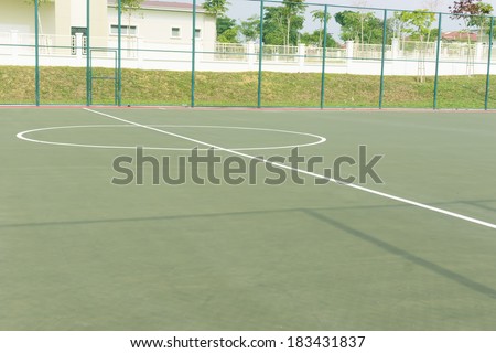 Halfway line and sphere shape marking at middle of outdoor futsal court