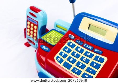 Colorful toy cash register on white background