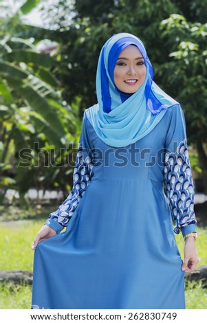 Portrait of young beautiful Asian muslim woman wearing hijab.