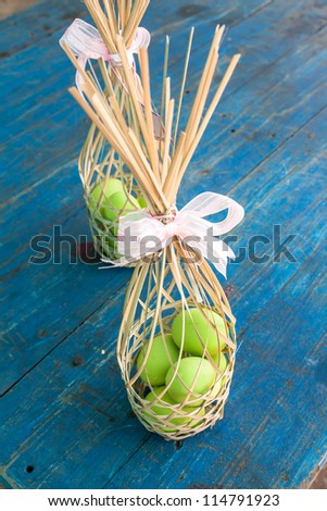 preserved egg in bamboo basketry on wood background