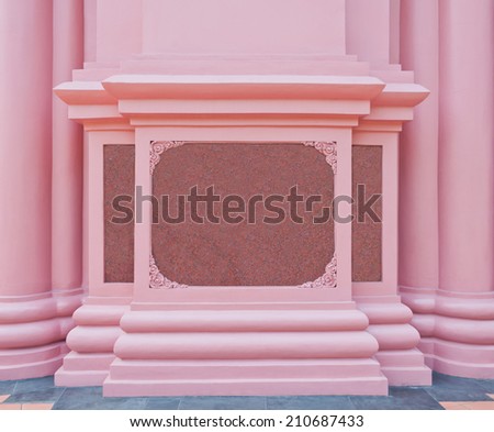 The pink marble plate on the pink wall as background
