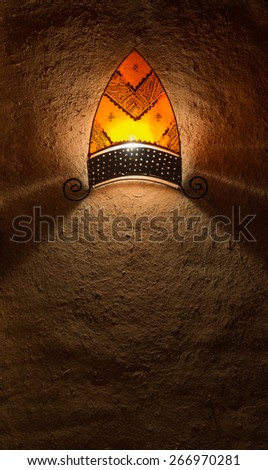 The traditional lantern in arabian style hang on the soil wall