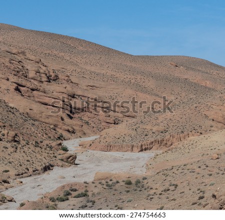 The dried river on the way to Gorges du Dades valley which is sedimentary rock during end of winter and beginning of spring in Gorges du Dades or DadÃ?Â¨s Gorges city which located in Morocco