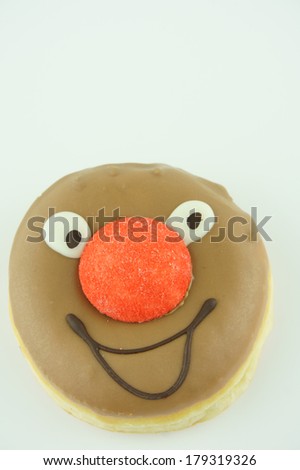cake with painted face and red nose
