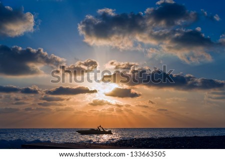 clouds in the blue sky, the sun, the sea and the boat