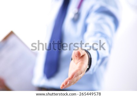 Midsection of male doctor extending his hand for a handshake in clinic