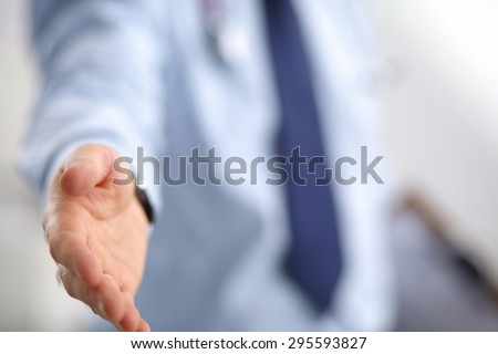 Portrait of businessman giving hand for handshake