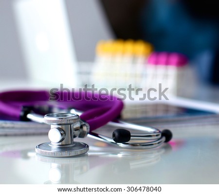 Doctor at work, close up of male doctor typing on a laptop