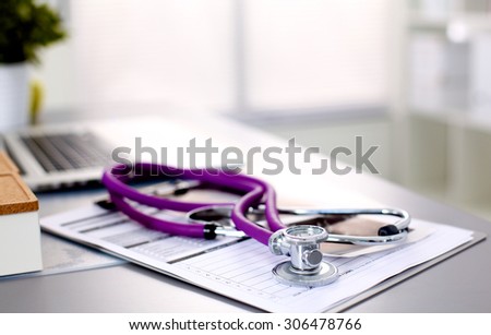 Young doctor at the table is receiving patient