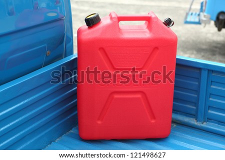 Red Gasoline refill tank on mini  pickup truck