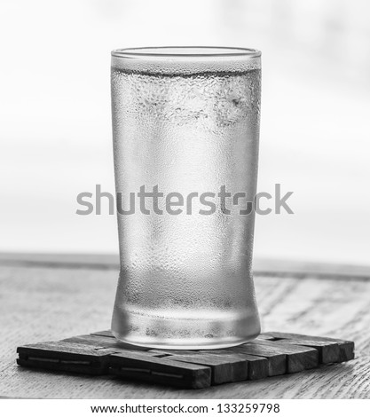 Cold drinking water in glass with water droplet