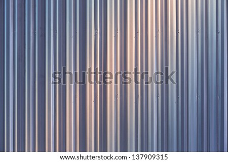 Corrugated metal sheet wall background texture inside of building