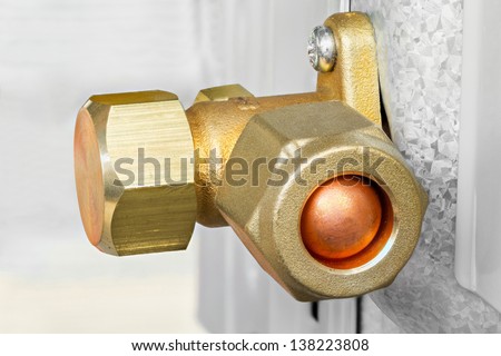Close up air conditioner service and shut off valve on new condenser unit - deep focus photo