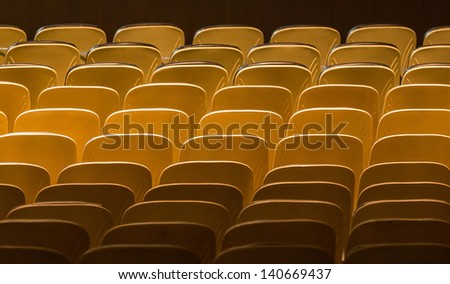 Theater seats in rows from back view