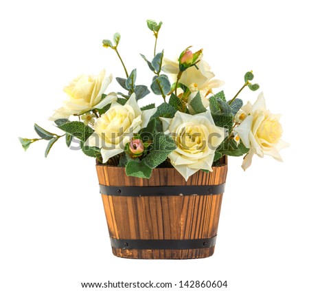 Bouquet of white rose in wood bucket isolated on white