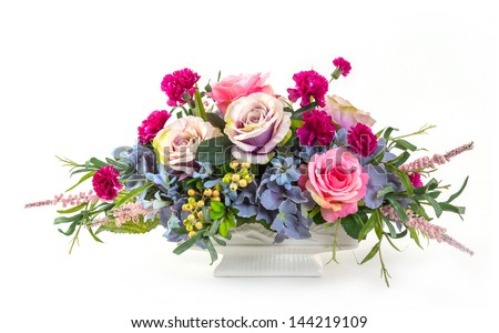 Bouquet of rose, hydrangea, berry and carnation flowers in ceramic pot