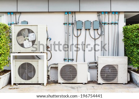 Close up air conditioner heating units installation outside of building