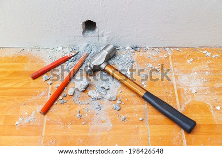 Dig or drill a hole in the cement wall using cold chisels and hammer