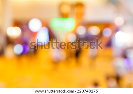 Abstract blurry people in exhibition event hall
