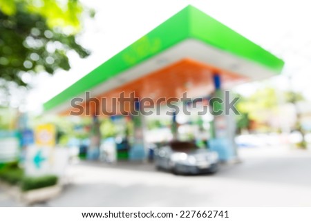 Blurry gas station with car fill up fuel in daytime