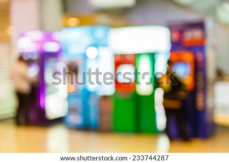 Abstract blurry automatic teller machine or ATM in building