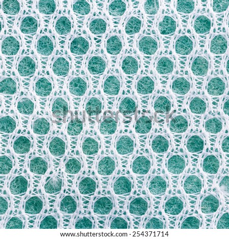 Close up old sponge cleaning pad with nylon net texture