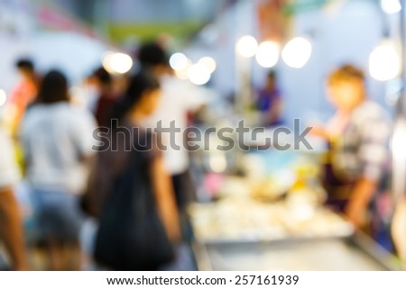 Abstract blurred people buying food in supermarket