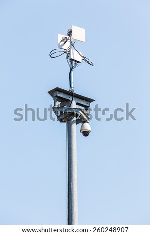 CCTV IP camera with wireless network on blue sky