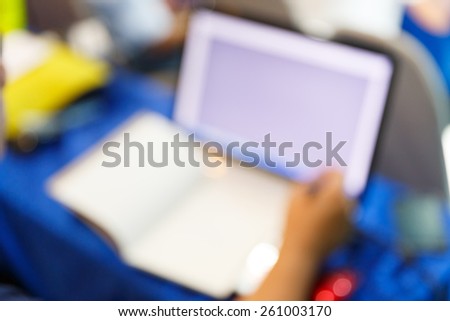 Abstract blurred notebook lecture in seminar room, education concept