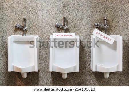 Close up out of order men urinal in male restroom