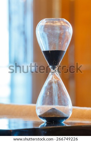 Close up hourglass or sand glass in living room, time value  concept