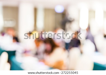 Abstract blurred people lecture in seminar room, education or business concept