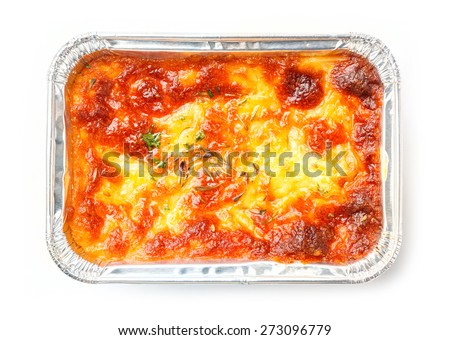 Close up beef lasagna in foil tray isolated on white, deep focus image, delicatessen