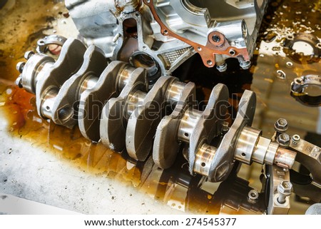 Engine crankshaft repairing cleaning in garage, automotive service station