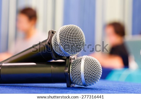 Close up old wireless microphone in conference room, education concept