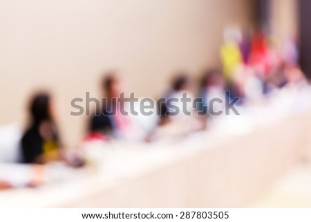 Abstract blurred people in meeting room, business concept