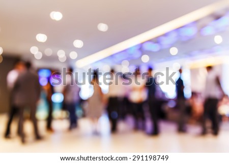 Abstract blurred people at party with light bokeh background