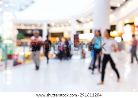 Abstract blurred people shopping in supermarket, urban lifestyle concept