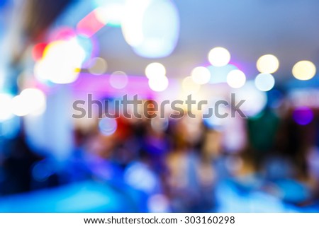 Abstract blurred people in game center, entertainment concept