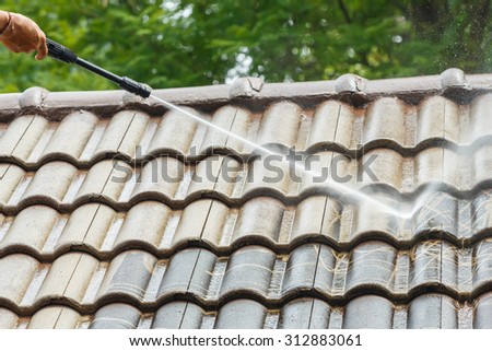 Roof cleaning with high pressure water cleaner