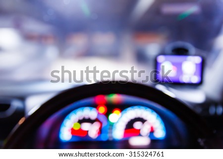 Abstract blurred traffic light on road from driver view, urban lifestyle