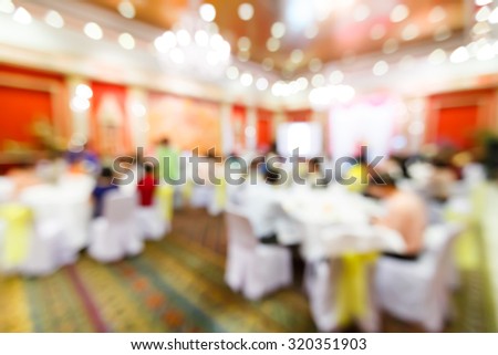 Abstract blurred people in restaurant or food center with light bokeh background, party lifestyle