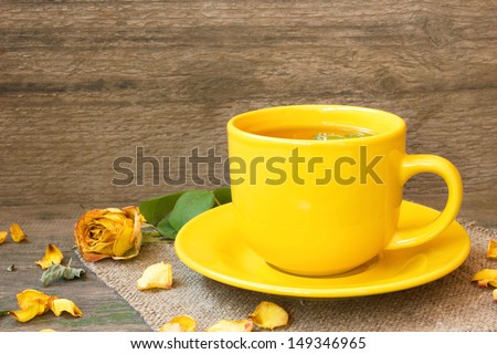yellow mug of green herbal tea