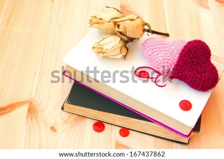 old vintage books and knitted hearts