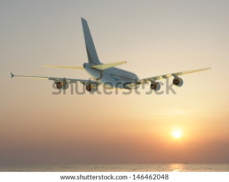 corporate jet airplane flying at sunset