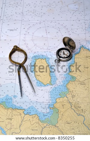 stock photo : Charting the course. Antique navigation instruments on an old 