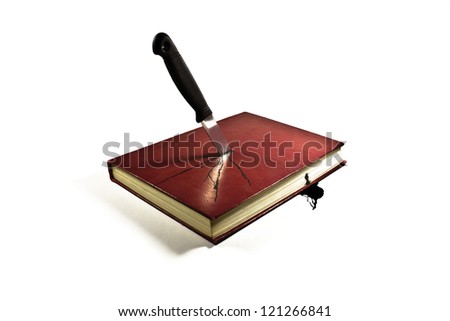 Book stabbed by knife and bleeding ink on white background