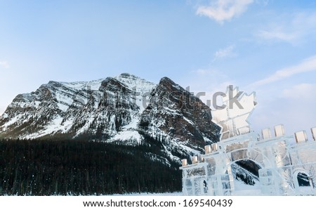 Canadian maple leaf ice carving with mountains in background
